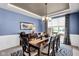 Formal dining room with modern chandelier and traditional wood furniture at 1313 Brentford Ln, Greenwood, IN 46143