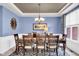 Formal dining room with patterned rug and traditional wood furniture at 1313 Brentford Ln, Greenwood, IN 46143