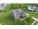 Beautiful two-story home with brick and siding, lush landscaping, and a well-manicured lawn at 1313 Brentford Ln, Greenwood, IN 46143