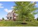 Well-maintained two-story home showcasing a landscaped yard and inviting curb appeal at 1313 Brentford Ln, Greenwood, IN 46143