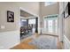 Inviting foyer with hardwood floors offering views of dining and living spaces at 1313 Brentford Ln, Greenwood, IN 46143