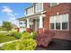Beautiful red brick home with a cozy front porch and meticulously maintained landscaping at 1313 Brentford Ln, Greenwood, IN 46143