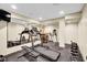 Home gym with treadmill, weights, and mirrored wall for effective workouts at 1313 Brentford Ln, Greenwood, IN 46143