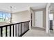 Hallway with chandelier and view to the entryway at 1313 Brentford Ln, Greenwood, IN 46143