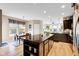 Stylish kitchen with island, granite countertops, and adjacent dining area is perfect for entertaining at 1313 Brentford Ln, Greenwood, IN 46143