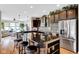 Spacious kitchen features dark cabinetry, granite countertops, and stainless steel appliances at 1313 Brentford Ln, Greenwood, IN 46143