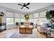 Bright and airy living room features large windows and comfortable seating at 1313 Brentford Ln, Greenwood, IN 46143