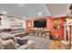 Cozy living room with comfortable seating, rustic decor, and a large entertainment center at 1313 Brentford Ln, Greenwood, IN 46143