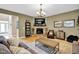 Inviting living room with stone fireplace, hardwood floors, and a neutral color palette at 1313 Brentford Ln, Greenwood, IN 46143
