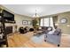 Cozy living room with stone fireplace and hardwood floors creates a relaxing atmosphere at 1313 Brentford Ln, Greenwood, IN 46143