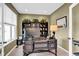 Well-lit office space featuring a large desk and built-in shelving at 1313 Brentford Ln, Greenwood, IN 46143