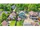 Aerial view of a neighborhood featuring a home with a large wooden deck and a fenced yard at 140 W Hampton Dr, Indianapolis, IN 46208