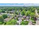 Aerial view of residential neighborhood with lush green trees on sunny day in summer at 140 W Hampton Dr, Indianapolis, IN 46208