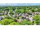 Aerial view of residential neighborhood with lush green trees on sunny day in summer at 140 W Hampton Dr, Indianapolis, IN 46208