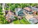 Aerial view of the backyard featuring an outdoor deck and well maintained landscaping in a suburban neighborhood at 140 W Hampton Dr, Indianapolis, IN 46208