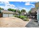 Spacious backyard featuring a basketball hoop, a deck and a well-maintained two-car garage, perfect for outdoor activities at 140 W Hampton Dr, Indianapolis, IN 46208