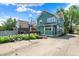 The backyard features a basketball hoop, a deck and a well maintained lawn at 140 W Hampton Dr, Indianapolis, IN 46208