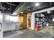 Unfinished basement with washer, dryer, utility sink, storage, and open ceiling at 140 W Hampton Dr, Indianapolis, IN 46208