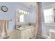 Bright bathroom with granite countertops, neutral walls and flooring, and a shower/tub combo at 140 W Hampton Dr, Indianapolis, IN 46208