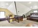 Spacious bedroom with a carpeted floor, wooden trim, and a unique ceiling at 140 W Hampton Dr, Indianapolis, IN 46208