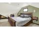 Bedroom with a carpeted floor, wooden trim, a unique ceiling and a large bed at 140 W Hampton Dr, Indianapolis, IN 46208