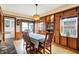 Charming dining room with built-in cabinets, hardwood floors, and a view of the backyard at 140 W Hampton Dr, Indianapolis, IN 46208