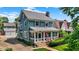 Charming two-story home with a welcoming front porch and well-maintained landscaping and a detached two car garage at 140 W Hampton Dr, Indianapolis, IN 46208