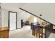 Hallway with a carpeted floor, wooden trim, and view to a bedroom at 140 W Hampton Dr, Indianapolis, IN 46208