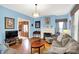Inviting living room with neutral sofas, fireplace, and hardwood floors, perfect for entertaining at 140 W Hampton Dr, Indianapolis, IN 46208