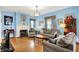 Comfortable living room featuring a fireplace, hardwood floors, and stylish decor at 140 W Hampton Dr, Indianapolis, IN 46208