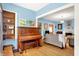 Cozy living room with hardwood floors, built-in bookshelves, and a decorative fireplace at 140 W Hampton Dr, Indianapolis, IN 46208