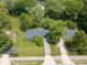 Expansive aerial view of a single-story home with lush green landscaping and a long private driveway at 1408 126Th St, Carmel, IN 46033