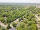 An aerial view of the landscape, lush trees, and a single-story house neighborhood at 1408 126Th St, Carmel, IN 46033