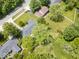 A bird's eye view reveals a large green lot and a house with garden at 1408 126Th St, Carmel, IN 46033