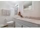 Cozy bathroom with a single sink vanity, framed mirror, and neutral finishes at 1408 126Th St, Carmel, IN 46033