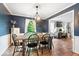 Dining room with an elegant chandelier, wood floors and an abundance of natural light at 1408 126Th St, Carmel, IN 46033