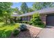 Well-maintained brick home with lush landscaping, a brick walkway, and a two-car garage at 1408 126Th St, Carmel, IN 46033