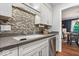 This kitchen showcases stone countertops, a mosaic backsplash, and stainless steel appliances at 1408 126Th St, Carmel, IN 46033