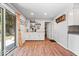 Open kitchenette with coffee bar, modern lighting, glass doors, and ample counter space at 1408 126Th St, Carmel, IN 46033