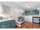 Functional laundry room with washer, dryer, utility sink, custom cabinets, and stylish decor at 1408 126Th St, Carmel, IN 46033