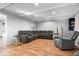 Cozy living room offers wood floors, neutral walls and recessed lighting throughout at 1408 126Th St, Carmel, IN 46033