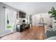 Bright living room featuring a workstation, large windows, and comfortable seating at 1408 126Th St, Carmel, IN 46033