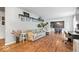 Open living space with hardwood floors, stylish decor, and a view into the adjacent dining area at 1408 126Th St, Carmel, IN 46033
