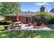 Back patio with picnic table, an outdoor seating area, and a well-maintained lawn at 1408 126Th St, Carmel, IN 46033