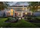 Beautiful backyard with string lights, a patio, and a well-maintained lawn at 14662 Woodstone Cir, Fishers, IN 46037