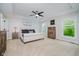 Spacious main bedroom features tray ceilings, fan, and a neutral color palette at 14662 Woodstone Cir, Fishers, IN 46037