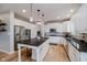 Bright kitchen features stainless steel appliances, granite countertops, and a center island at 14662 Woodstone Cir, Fishers, IN 46037