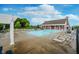 Community pool with ample seating, providing a refreshing and relaxing amenity for residents to enjoy at 14662 Woodstone Cir, Fishers, IN 46037