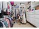 Organized walk-in closet with shelving, hanging rods, drawers, and dedicated shoe storage maximizing storage space at 14662 Woodstone Cir, Fishers, IN 46037