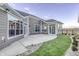 Exterior of home featuring a patio, grassy area, and views of the surrounding neighborhood at 14844 Higgins Dr, Westfield, IN 46074